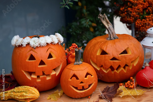 Halloween pumpkins on wooden floor. 