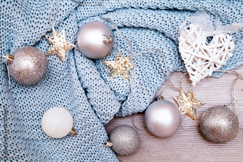 Christmas balls on a light blue knitted blanket