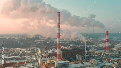 Aerial view of heating plant and thermal power station. Combined modern power station for city district heating and generating electrical power. Industrial zone from above, Vilnius, Lithuania. photo