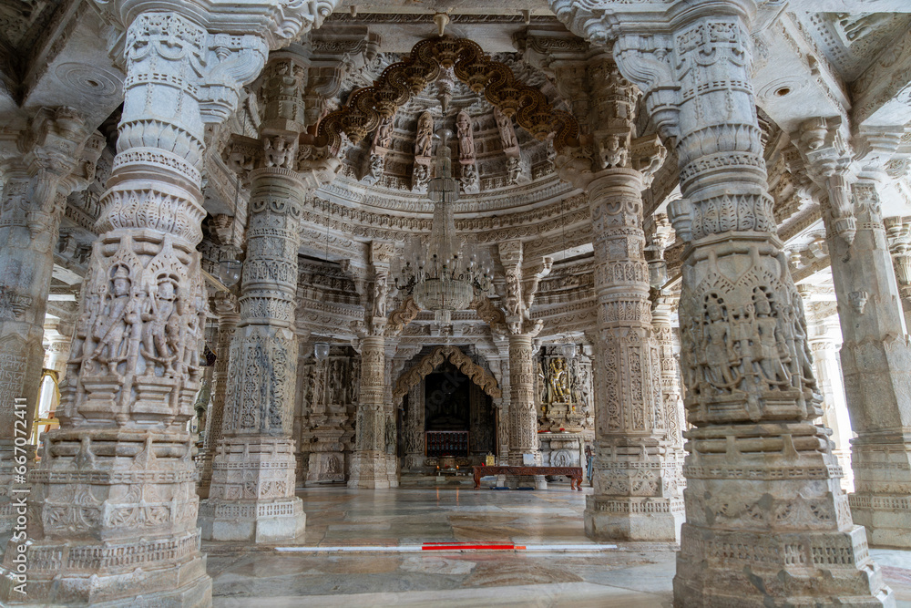 The interior is stunning, with unique carvings on the ceiling and columns. Marble carving decoration at the Jain temple in Ranakpur, Rajasthan, India.