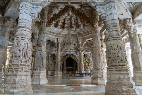 The interior is stunning, with unique carvings on the ceiling and columns. Marble carving decoration at the Jain temple in Ranakpur, Rajasthan, India.
