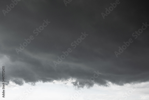 dark clouds make sky in black. Heavy rain thunderstorm. Pattern of clouds overcast predict tornado, Hurricane or thunderstorm and rainy. Dark sky cloudy have storm and lightning thunderbolt. © BESTIMAGE