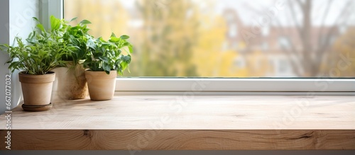 Installing a wooden window sill covered with oak veneer related to interior design and home improvement photo
