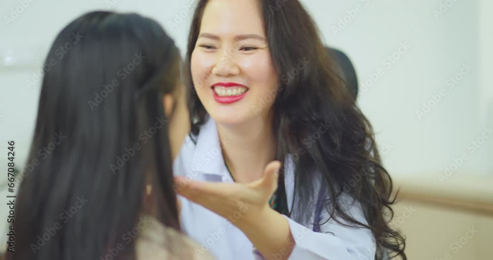 Female doctor talking with female patient at hospital room. They discussing about Illness with female patient at hospital. Female doctor talking with female patient at hospital room. They discussing about Illness with female patient at hospital.