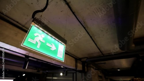 The arrow shows the direction to the exit, emergency exit photo