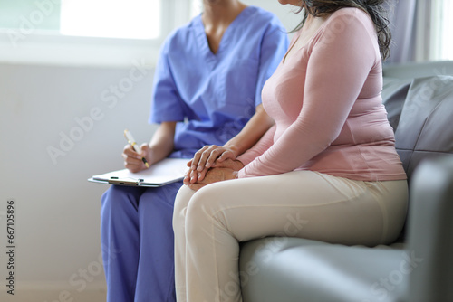 Senior woman visits doctor for examination at hospital examination room. Elderly health insurance.