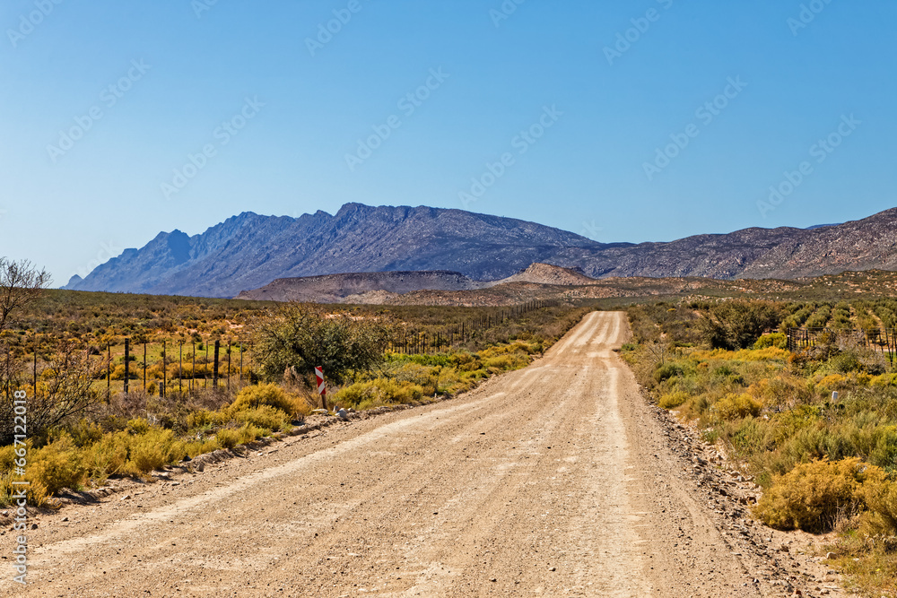 Rough gravel road along the Langeberg mountains in the Little Karoo in the Western Cape, South Africa