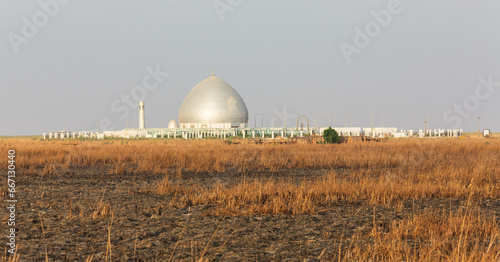 Mosque and Mudhif, the traditional house of Marsh arabs aka madan in Iraq photo