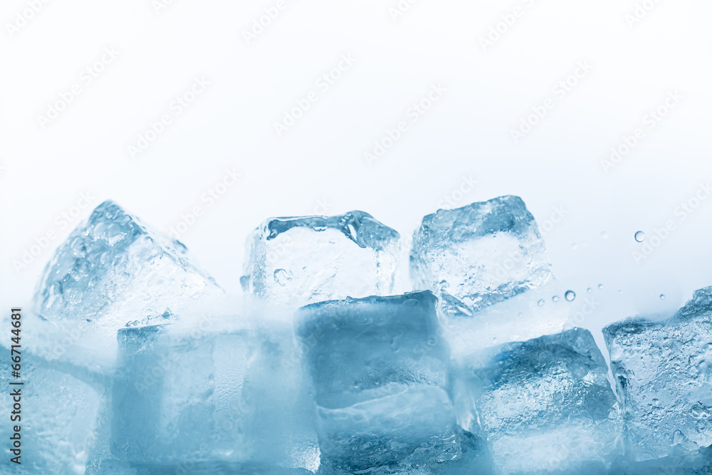 ice isolated white background,Natural crystal clear melting ice cubes on white reflective surface background. ice isolated white background,Natural crystal clear melting ice cubes on white reflective surface background.