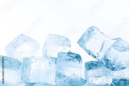 ice isolated white background,Natural crystal clear melting ice cubes on white reflective surface background.