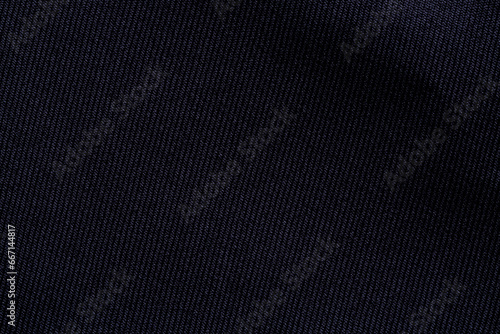 Black color sports clothing fabric football shirt jersey texture and textile background.,Smooth surface, fine black cloth, macro,