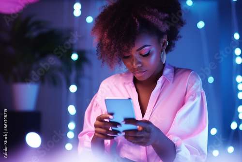 black girl portrait in her 20s female hands typing on smartphone device, working /chatting indoor environment, neon colors