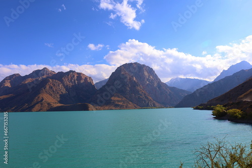 Turquoise mountain lake Iskandarkul located in Fann mountains, Sughd, Tajikistan photo