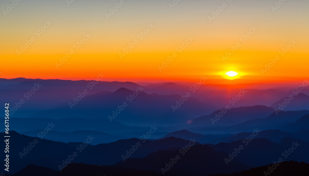 Morning over the foggy mountains. Sunrise and the landscape of mountain ranges.