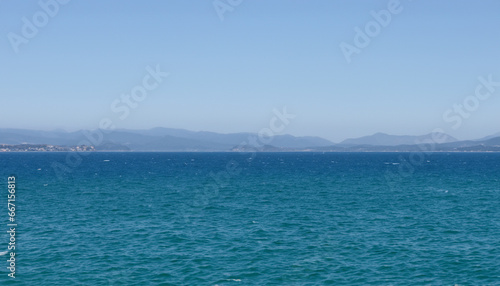 Seascape with sea horizon and clear blue sky in the background