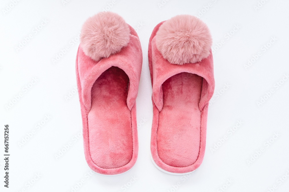 Pink home fluffy slippers on white background Pink home fluffy slippers on white background