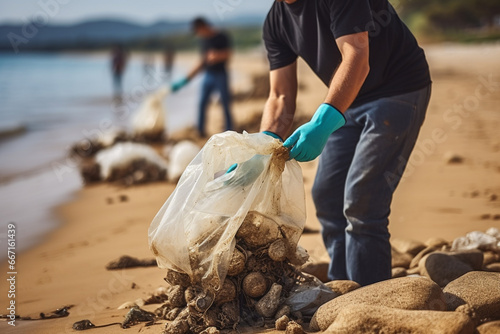 Volunteer collecting garbage on the beach. Recycling concept