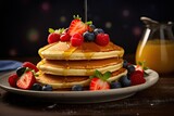 a stack of pancakes with syrup and berries on a plate.  generative ai