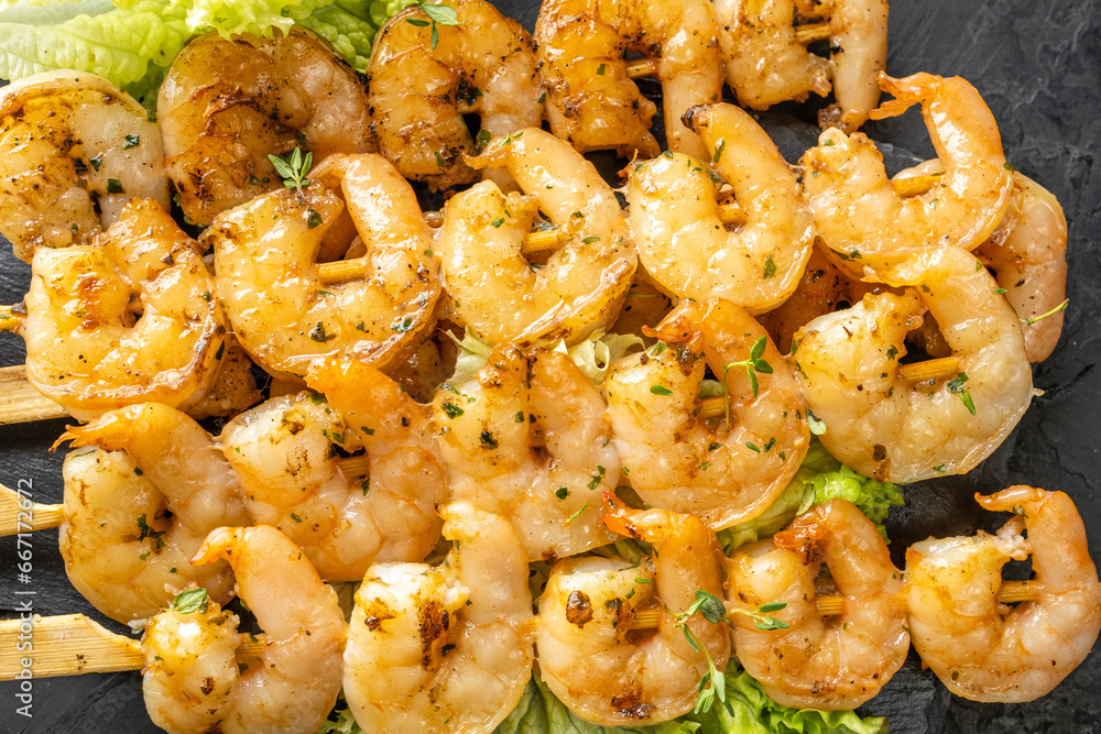 Grilled shrimp meat, shrimp kebab, yakitoriya, close-up, top view. Grilled shrimp meat, shrimp kebab, yakitoriya, close-up, top view.