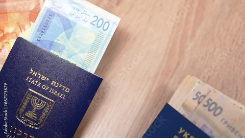 Passport of a citizen of Israel and passport of a citizen of Ukraine, repatriation, aliyah. Paper bills, new Israeli shekel and hryvnia. Absorption basket. Assistance under the Law of Return. photo