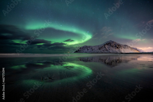 aurora borealis at flakstad beach  lofoten  norway