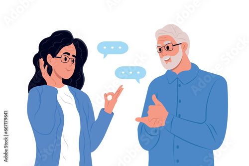 International day of sign languages. A pair of elderly deaf and mute people using sign language to communicate. A man and a woman with hearing impairment.