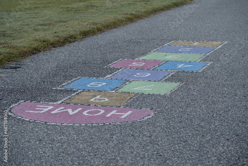 Brightly colored hopscotch squares in a public playground 