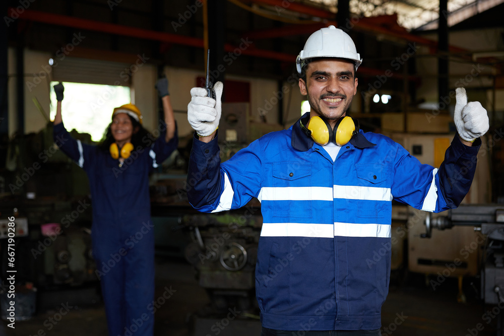 worker or engineer feeling excited and celebrate success pose in the factory worker or engineer feeling excited and celebrate success pose in the factory