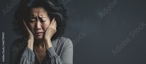 Distraught Asian woman in her forties photo