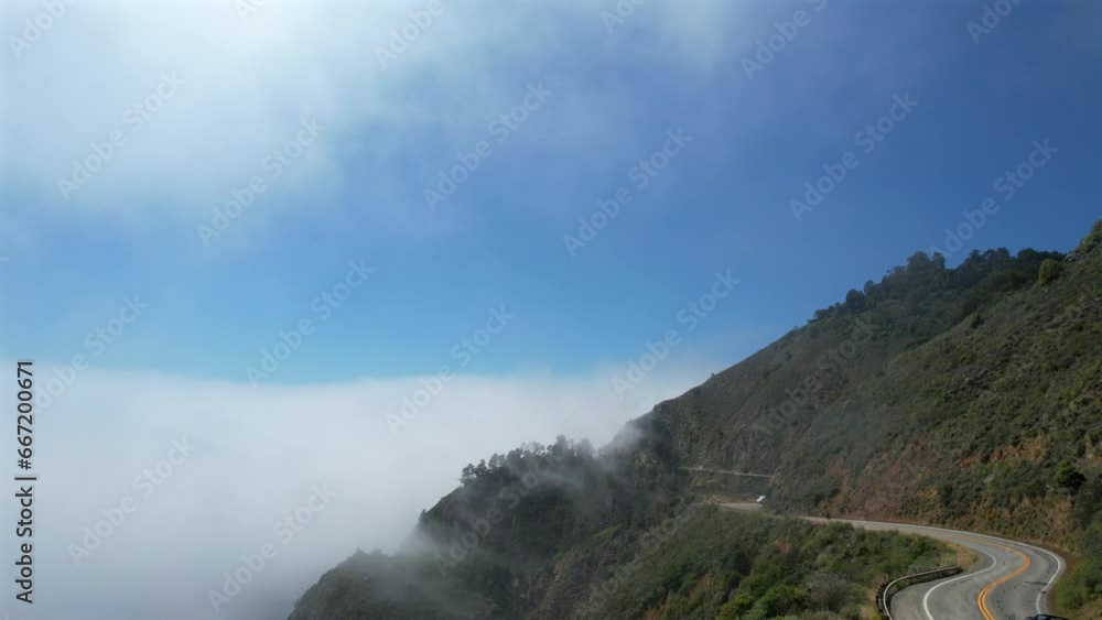 Amazing aerial view on pacific coast highway, route 1 landscape during daytime, above clouds Amazing aerial view on pacific coast highway, route 1 landscape during daytime, above clouds