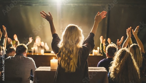 christians raising their hands in praise and worship at a night music concert eucharist therapy bless god helping repent catholic easter lent mind pray christian concept background photo