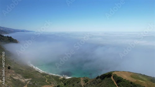 Amazing aerial view on pacific coast highway, route 1 landscape during daytime, above clouds