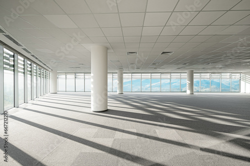 An empty workspace for the office. Huge panoramic windows with mountain views.