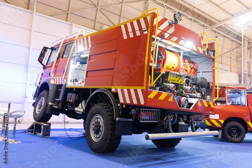 Red and orange large firefighter vehicle - offroad photo