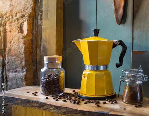 Yellow moka pots on the table, there is coffee beans in jar and its cafe ambiance photo