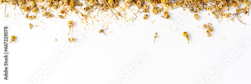 Camomile flowers on white background. Dried herbal tea photo