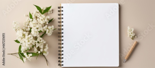 Eco friendly reusable handbag with space for business message featuring a notebook and linen flowers