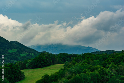Fototapeta Naklejka Na Ścianę i Meble -  green mountain landscape and cloudy sky