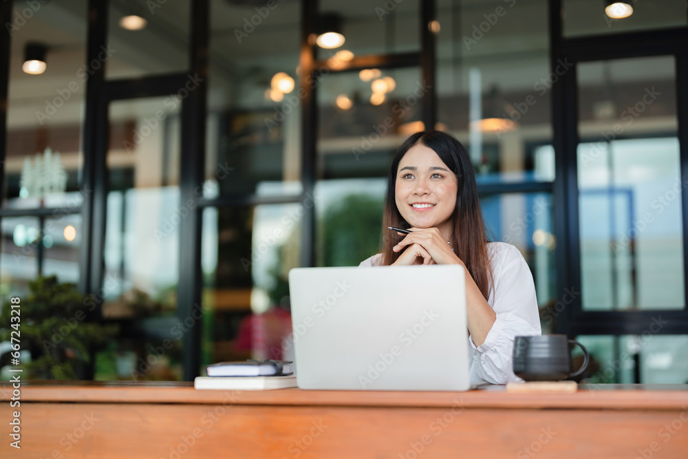 Writer woman thinking creative ideas for business data content and drinking coffee beverage in cafe.. Writer woman thinking creative ideas for business data content and drinking coffee beverage in cafe..
