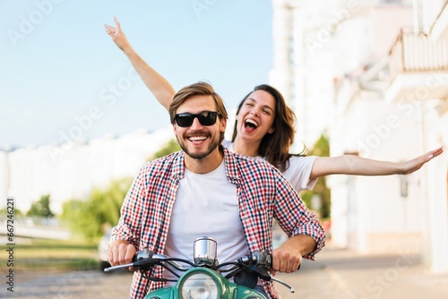 Couple in love riding a motorbike , Handsome guy and young sexy woman travel. Adventure and vacations concept.