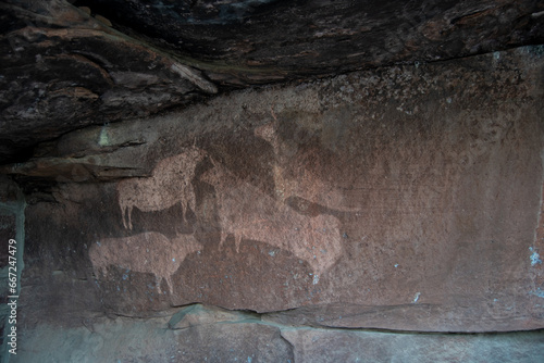 Cave paintings of the Abrigo de la Cocinilla del Obispo, Pinares Rodeno, Sierra de Albarracín, Albarracín, Aragón. photo