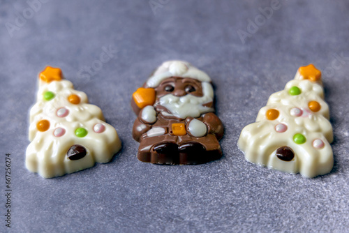 Christmas chocolates. Chocolate Christmas trees and Santa Claus.