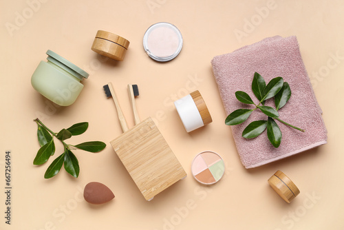 Composition with different bath supplies and plant branches on color background