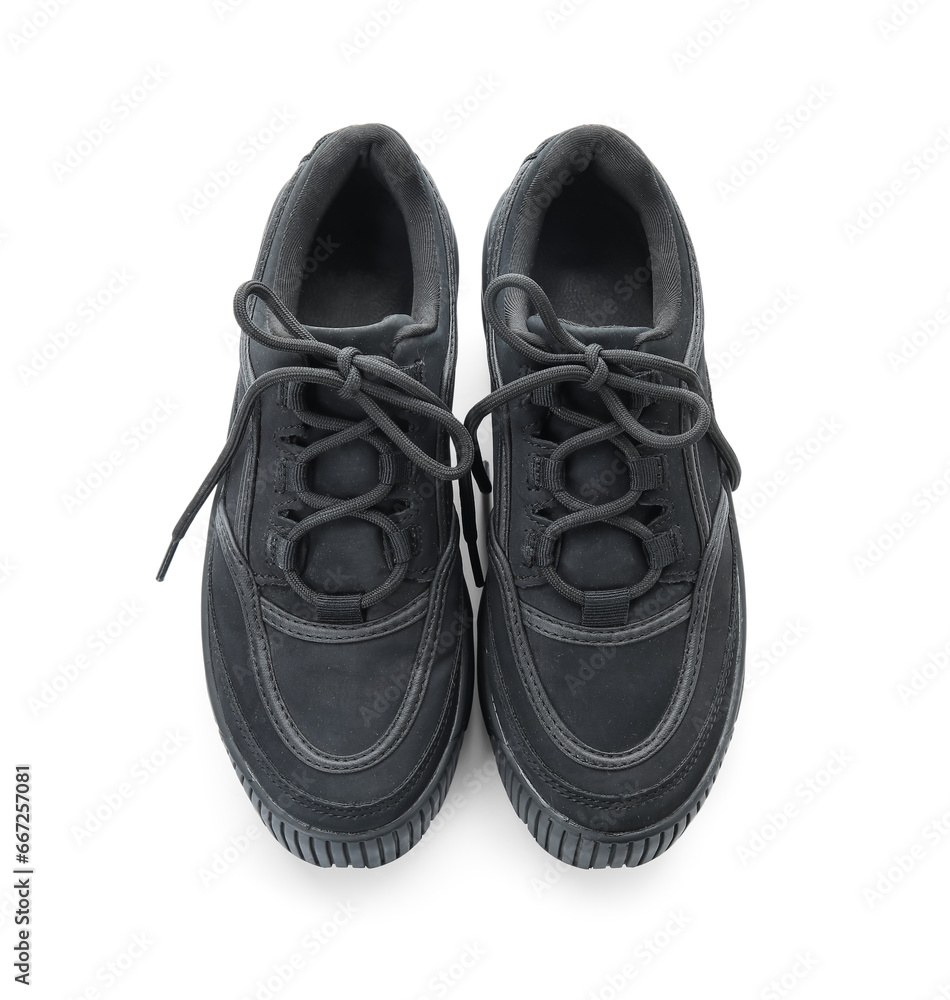 Stylish black sneakers on white background