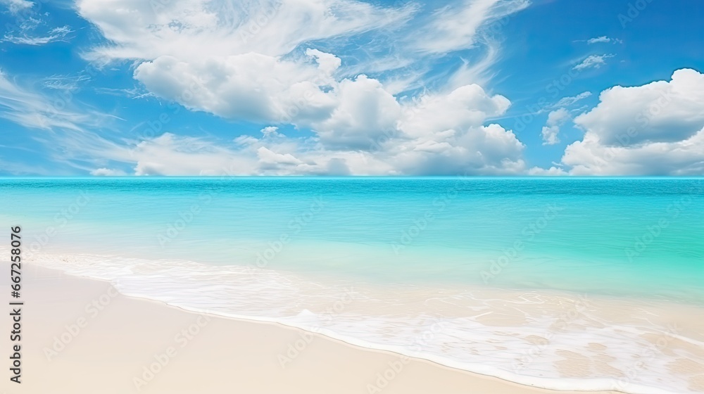 Beautiful sandy beach background. Bright summer sun over the ocean.Blue sky with light clouds, turquoise ocean with surf and clear white sand.