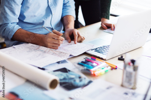 Close up of a male architect sketching building design in the office photo