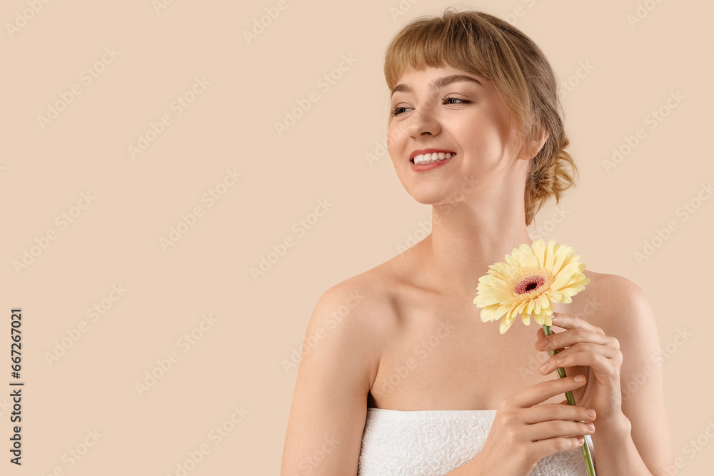 Beautiful young woman with flower on beige background, closeup Beautiful young woman with flower on beige background, closeup