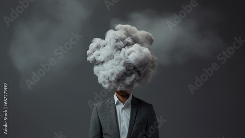 Man with cloud over his head depicting solitude and depression, abstract concept of loneliness and anxiety, isolated on gray background. Generative AI © Yuriy Maslov