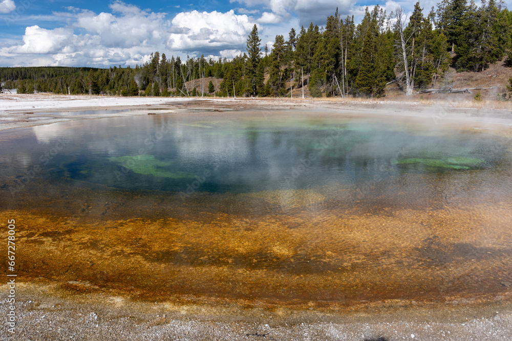 Beauty pool with steam rising from it in Yellowstone National Park Beauty pool with steam rising from it in Yellowstone National Park