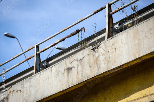 Cracks in the concrete structure of a bridge in a state of decay